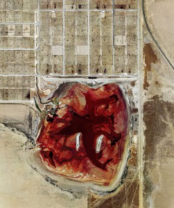 Photographer Mishka Henner documented factory farm pollutionâ€”like this waste lagoon at a Texas feedlotâ€”by satellite. What else could drone photography uncover?